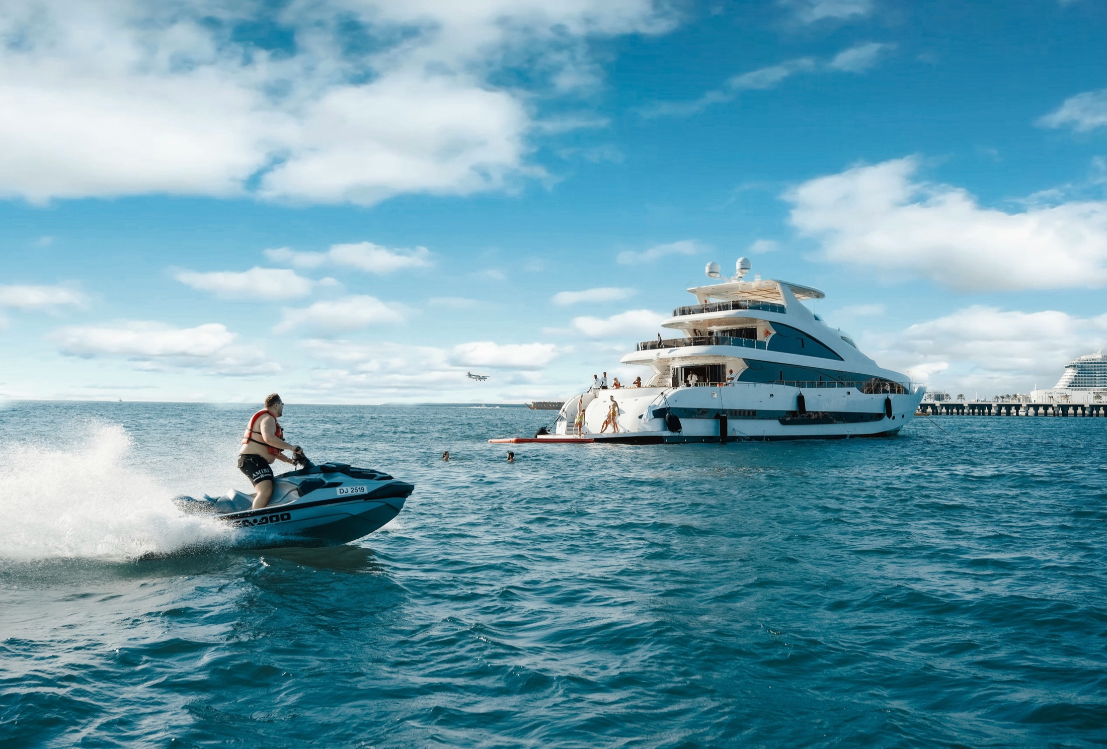 Yacht and jet ski on the water in Dubai